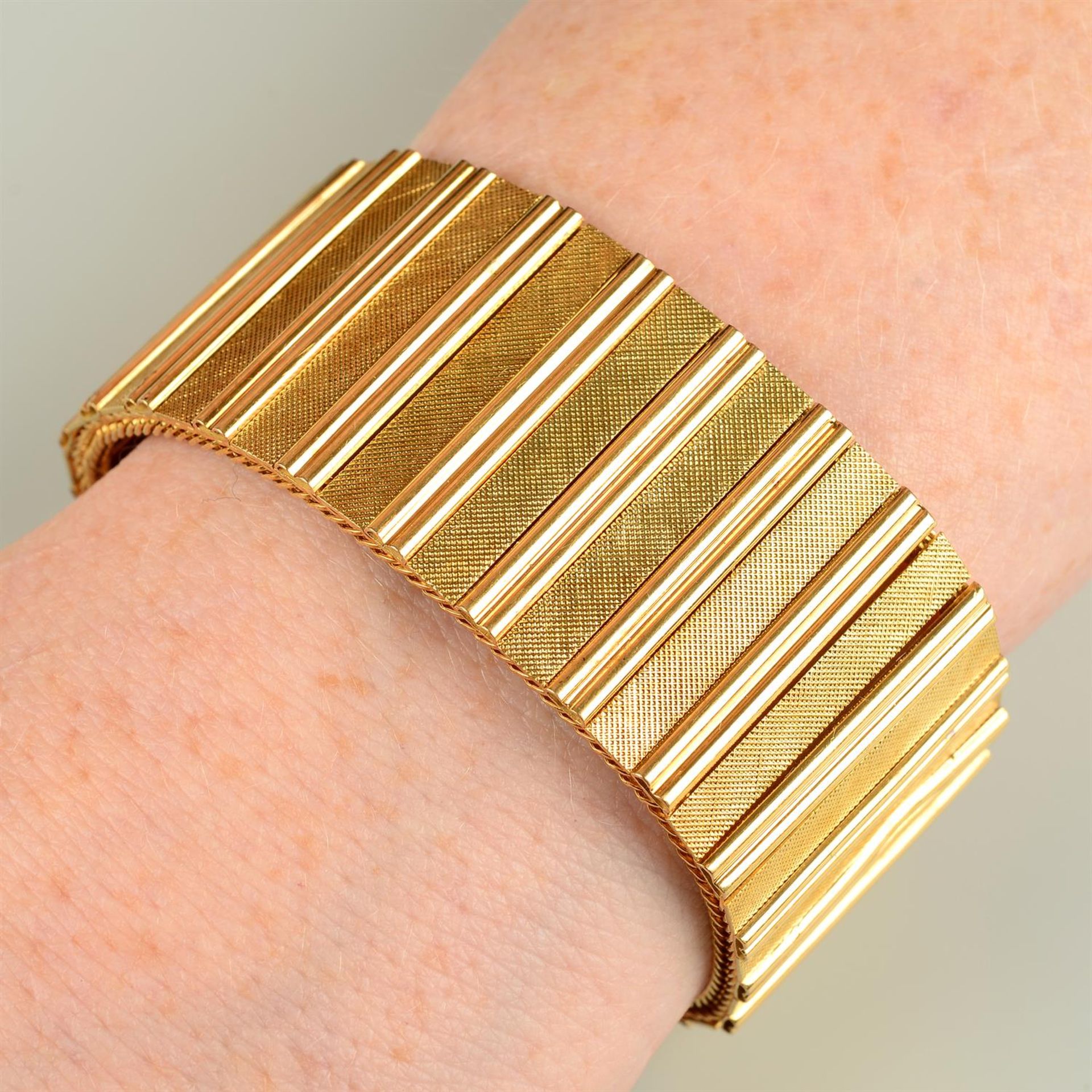 A mid 20th century Italian 18ct gold textured bracelet, by Unoaerre.