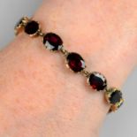 A Georgian gold foil-back garnet line bracelet.