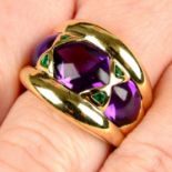 A gold cabochon amethyst and emerald dress ring.