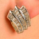 A pair of tapered baguette-cut diamond earrings.