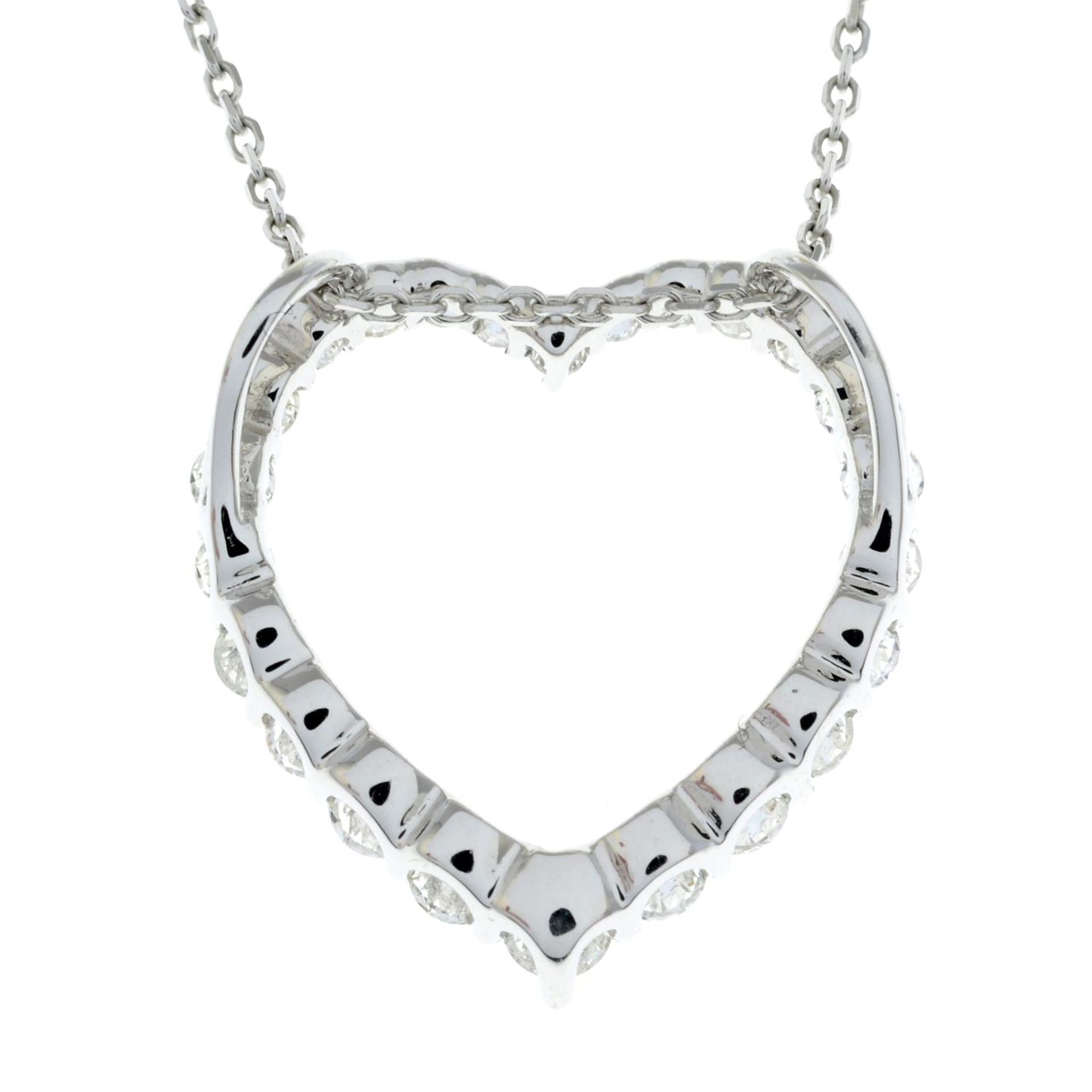 A graduated brilliant-cut diamond heart-shape pendant, with trace-link chain. - Image 3 of 5