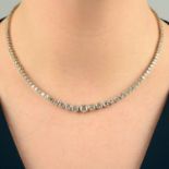 A graduated brilliant-cut diamond line necklace.