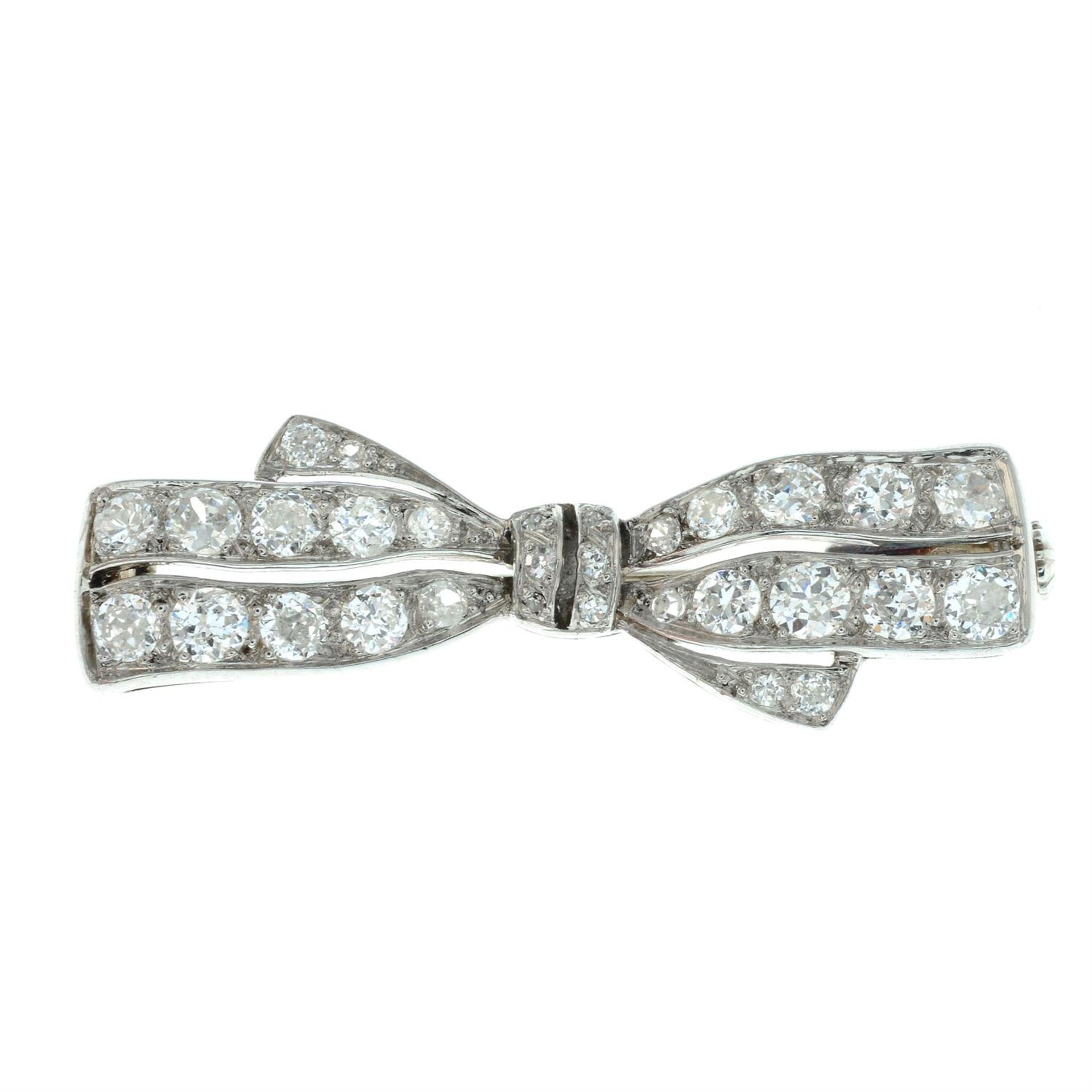 An early 20th century platinum and gold circular-cut diamond bow brooch. - Image 2 of 4