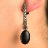 A pair of pavé-set diamond hoop earrings, with detachable black rubber and diamond drop.