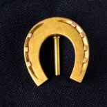 A late 19th century 18ct gold horseshoe stickpin.