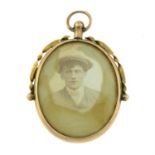 An Edwardian 9ct gold portrait miniature locket pendant.