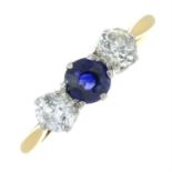 A sapphire and diamond three-stone ring.