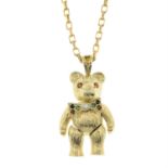 A 9ct gold multi-gem teddy pendant, with articulated bow tie and 9ct gold chain.