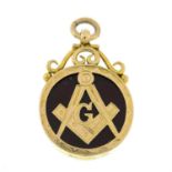 An early 20th century 9ct gold carnelian Masonic locket pendant.