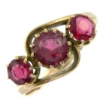 An early 20th century 9ct gold garnet-topped-doublet three-stone ring.