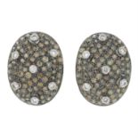 A pair of diamond and 'brown' diamond earrings.