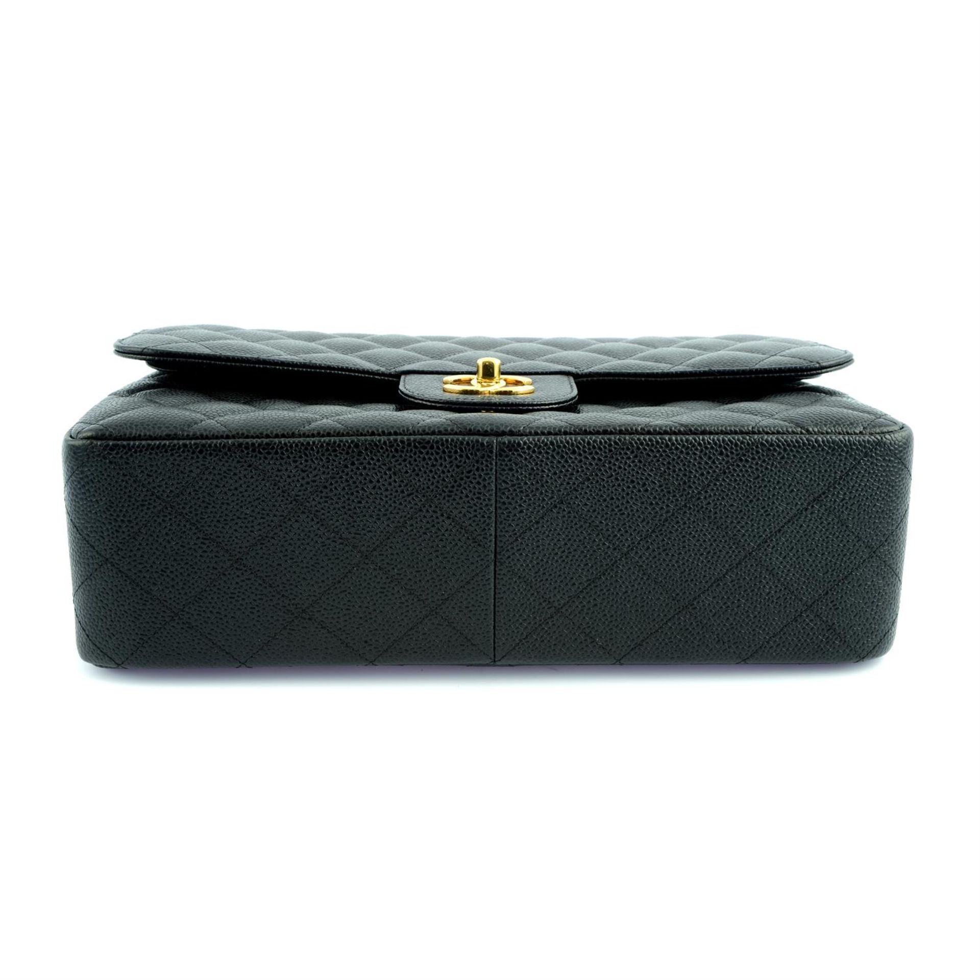 CHANEL - a black Caviar leather Jumbo Classic double flap handbag. - Image 4 of 6