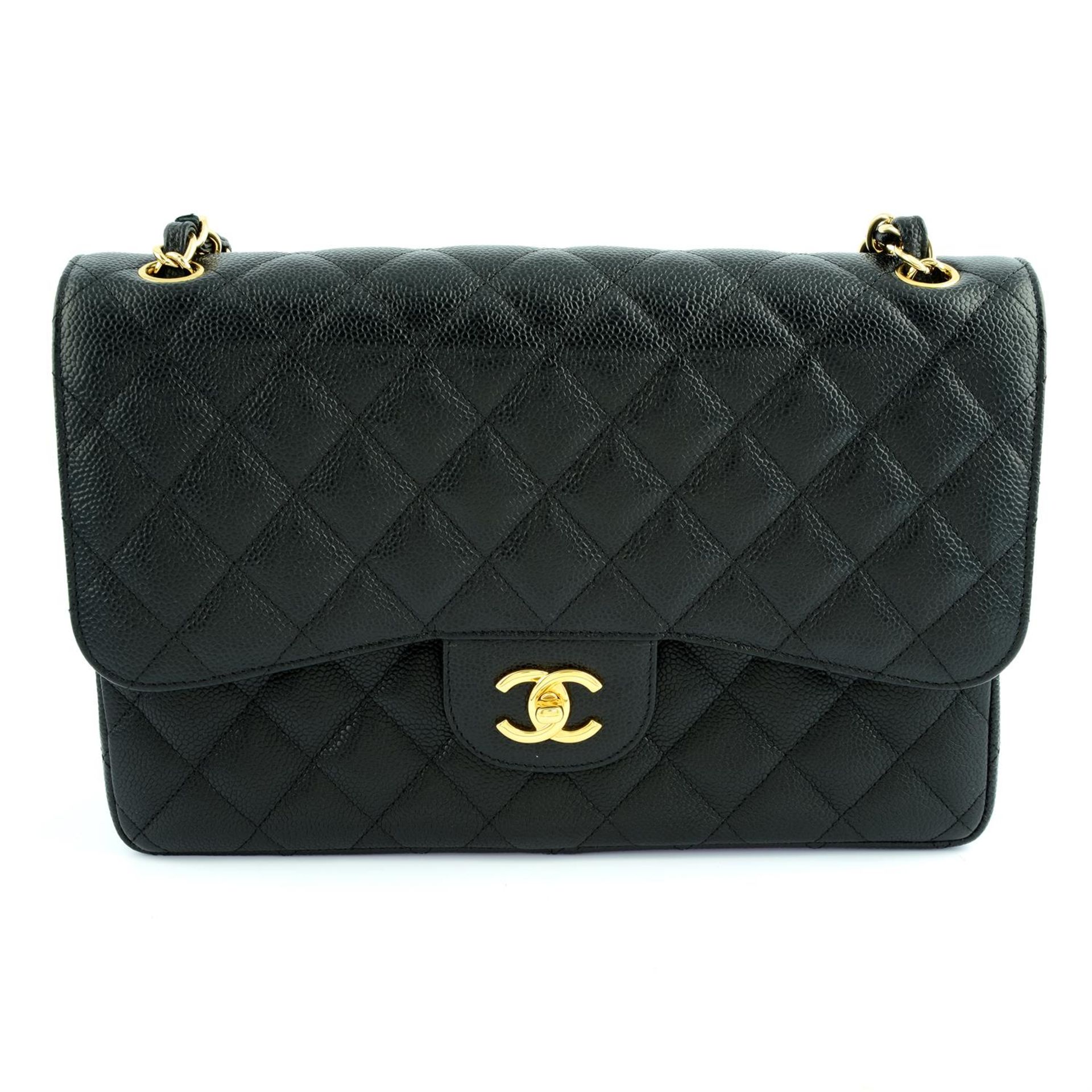 CHANEL - a black Caviar leather Jumbo Classic double flap handbag.