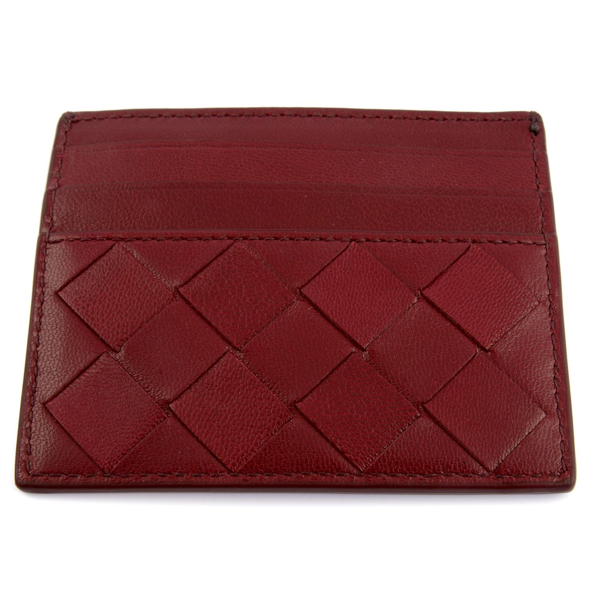BOTTEGA VENETA - a burgundy leather card holder. - Image 2 of 3