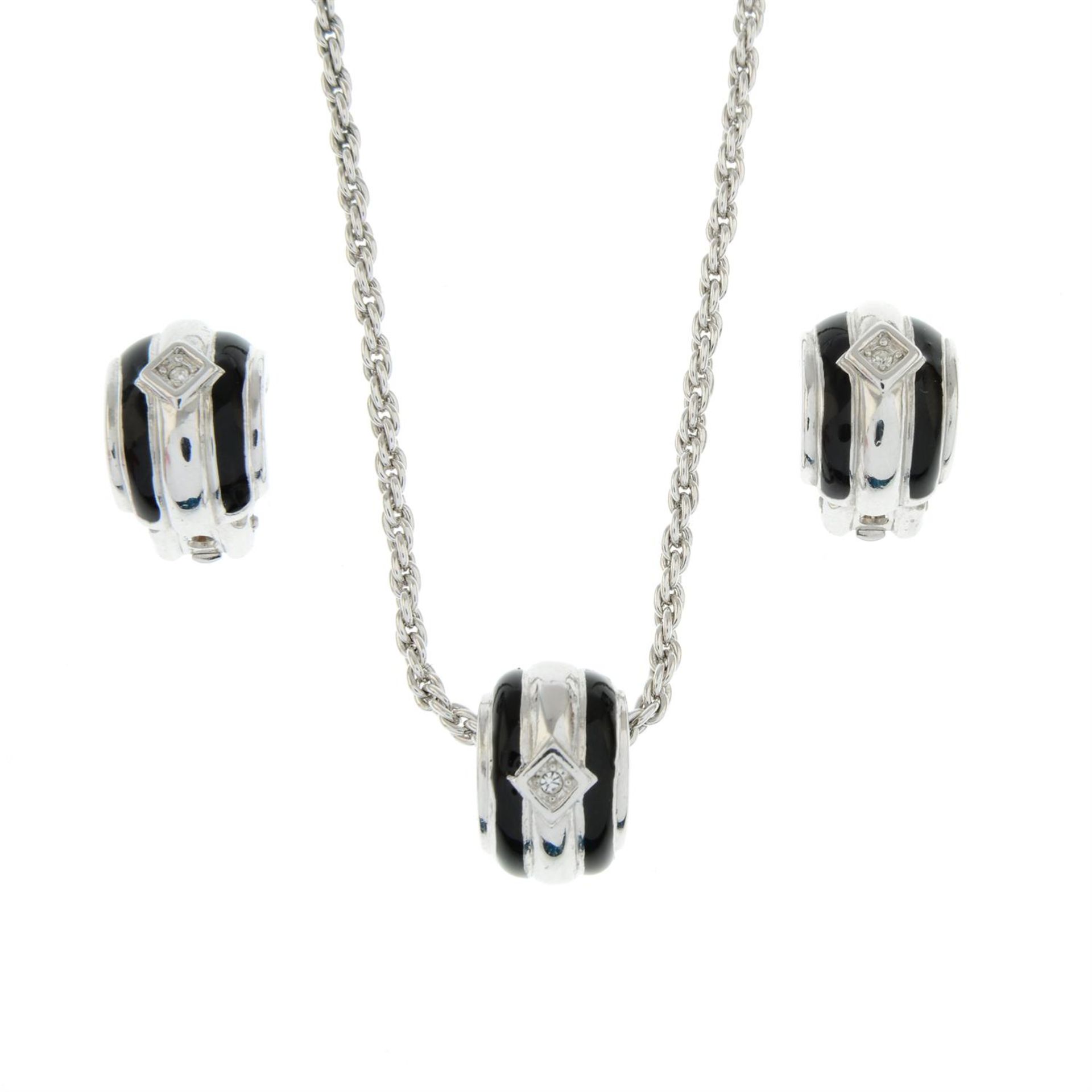 CHRISTIAN DIOR - a black enamel and paste set pendant necklace with matching earrings.