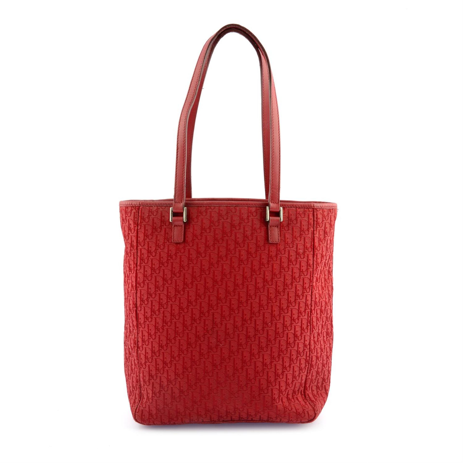 CHRISTIAN DIOR - a red canvas Trotter tote.