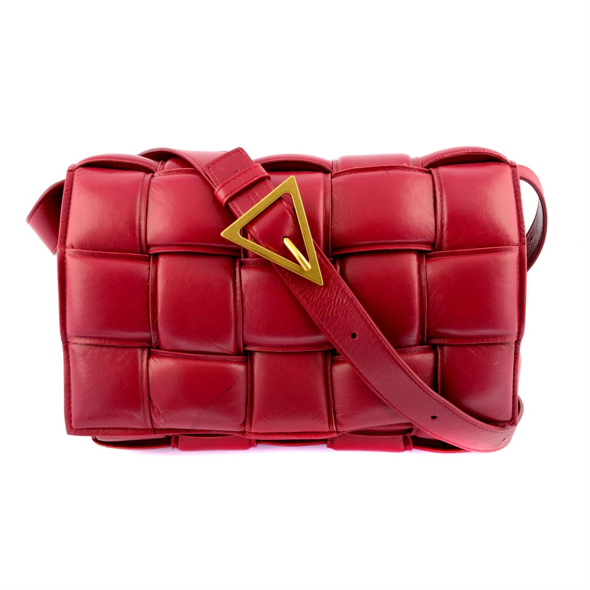 BOTTEGA VENETA - a burgundy paper calf leather Padded Cassette bag.