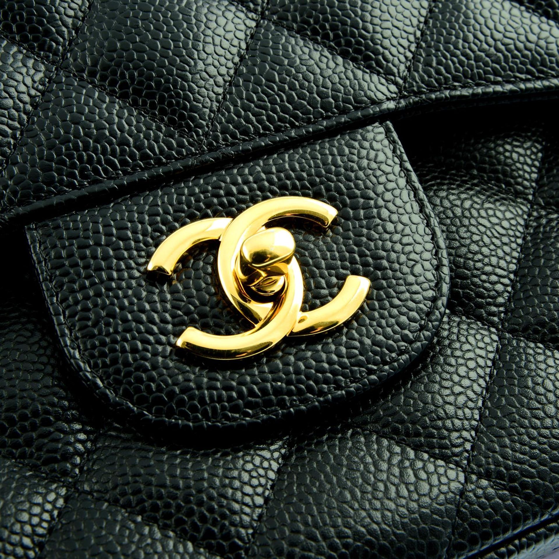 CHANEL - a black Caviar leather Jumbo Classic double flap handbag. - Image 5 of 6