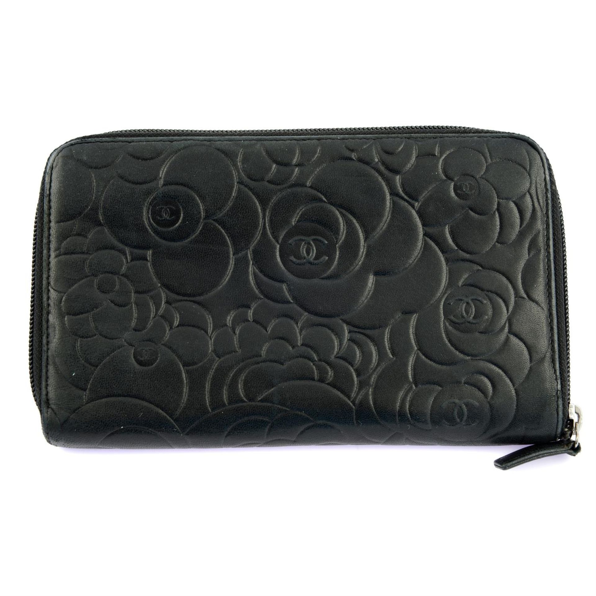 CHANEL – a black lambskin leather Camelia zip wallet. - Image 2 of 4
