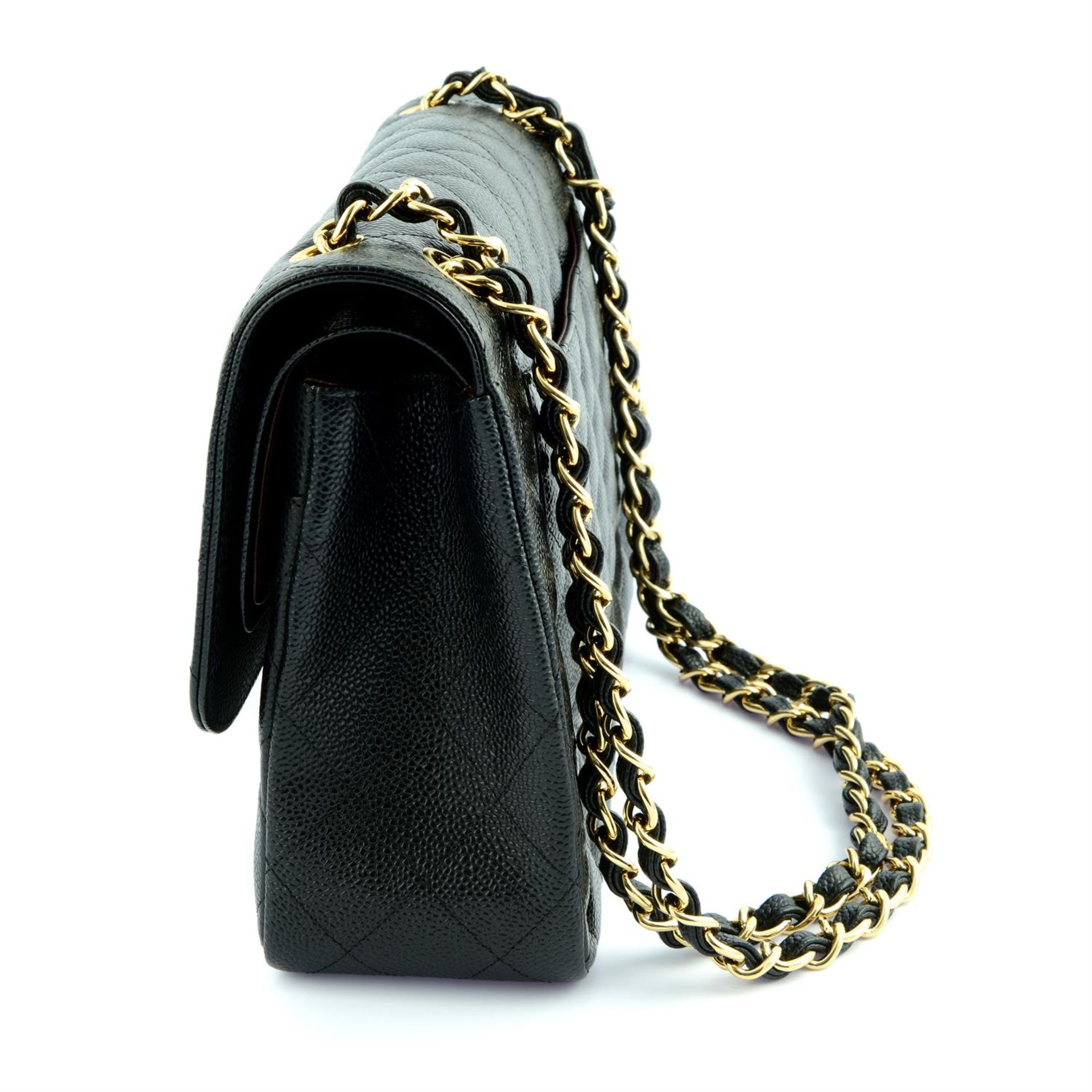 CHANEL - a black Caviar leather Jumbo Classic double flap handbag. - Image 3 of 6