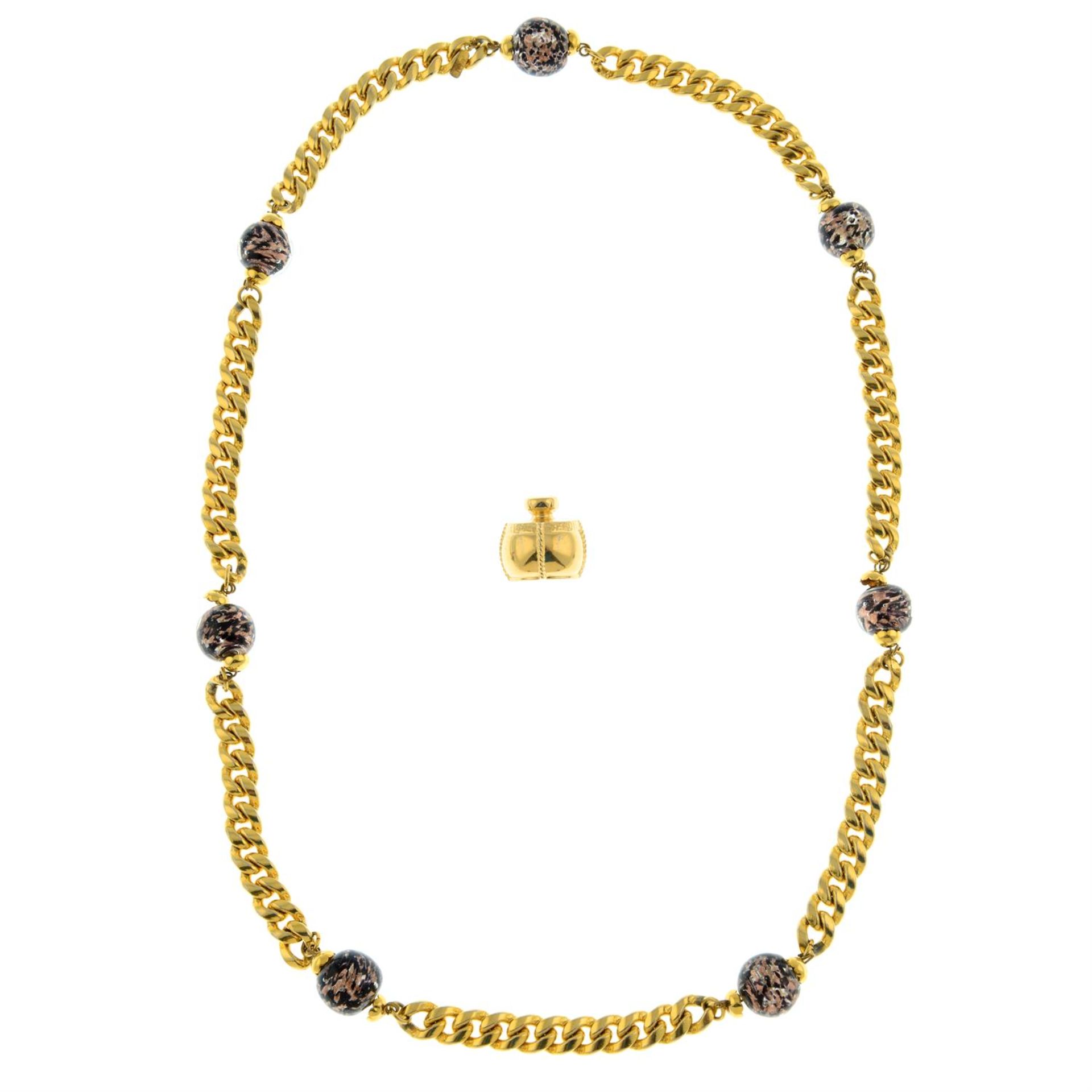 YVES SAINT LAURENT - a curb link necklace with repeating glass beads, together with a perfume