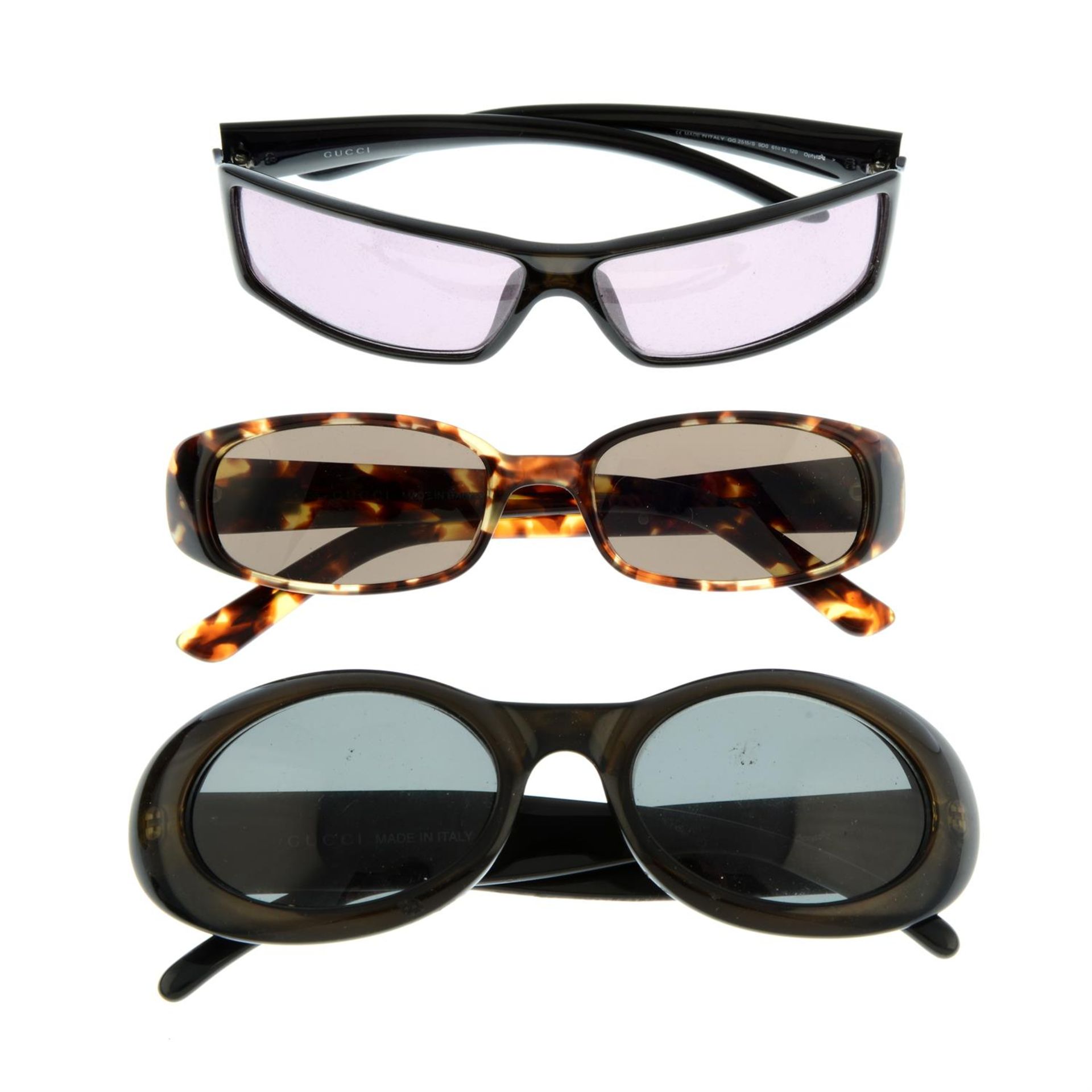 GUCCI - three pairs of sunglasses.