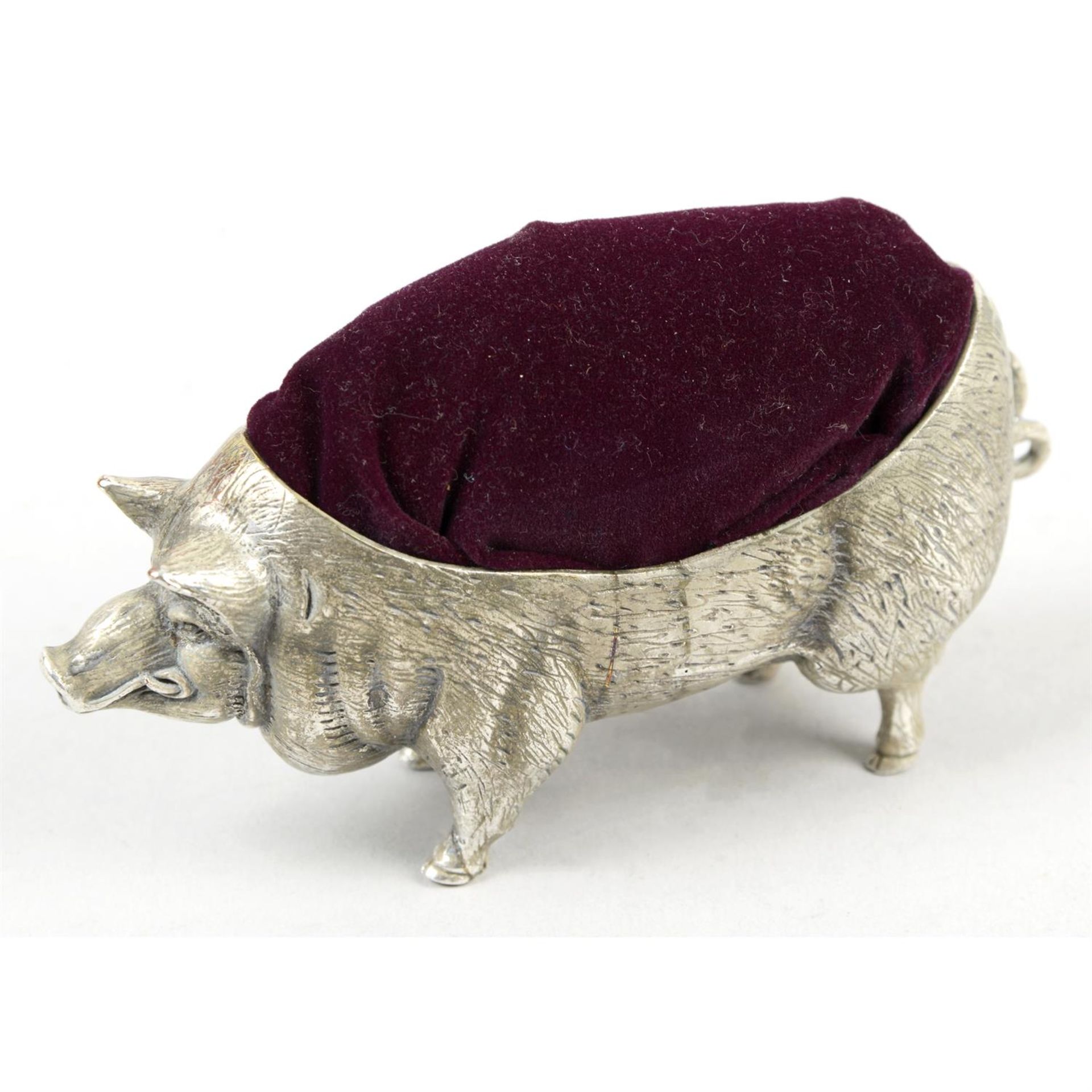 A pin cushion modelled as a pig, marked 800.