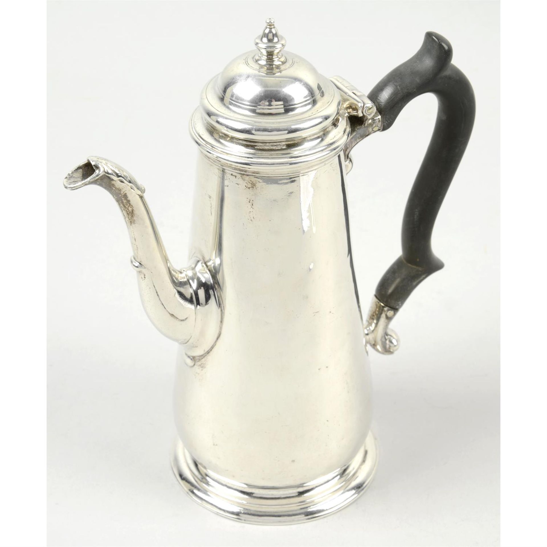 A George II silver coffee/chocolate pot.