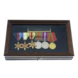 A group of five WWII medals, plus a Russian medal, all in glazed case. (6).