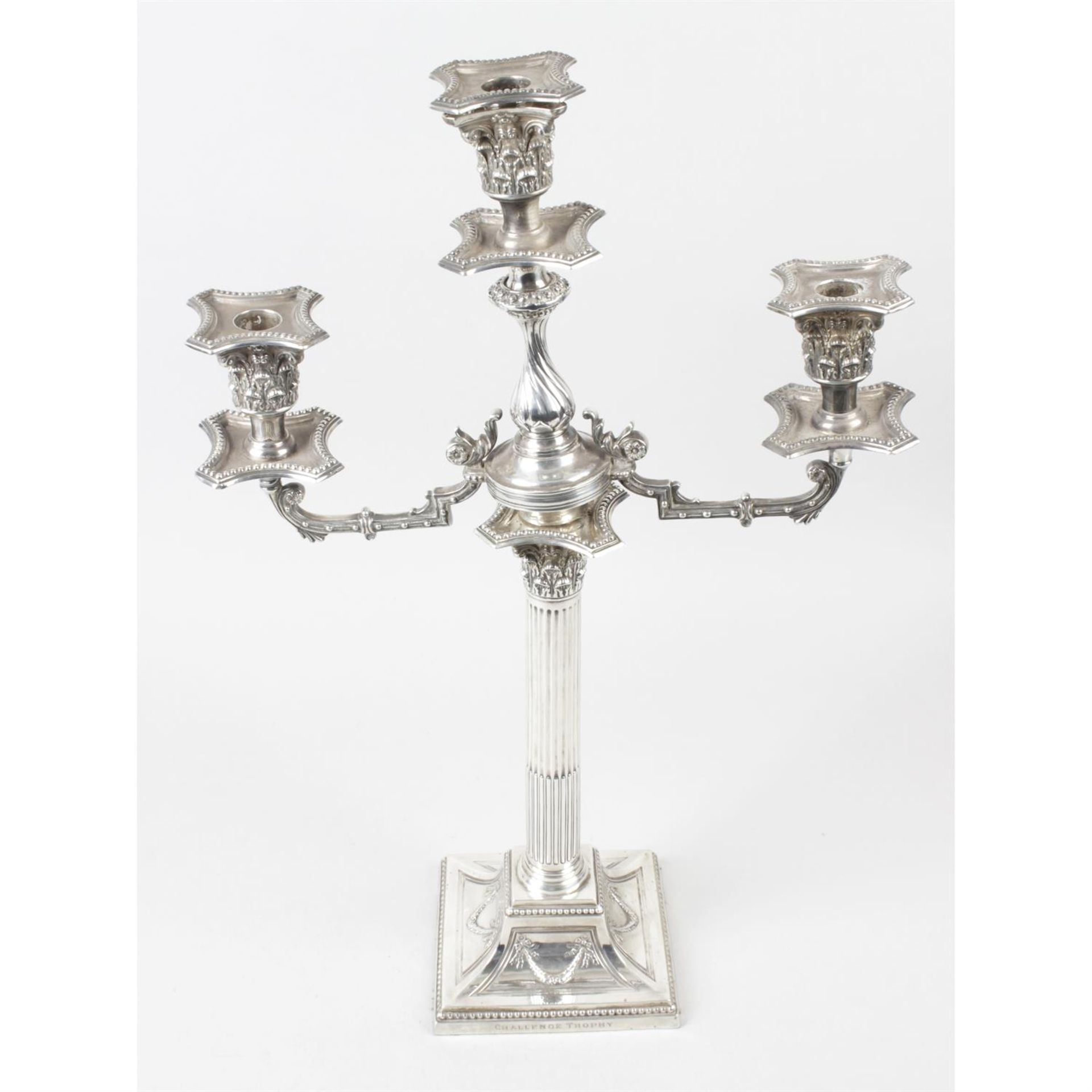 A late Victorian silver mounted two branch candelabrum.