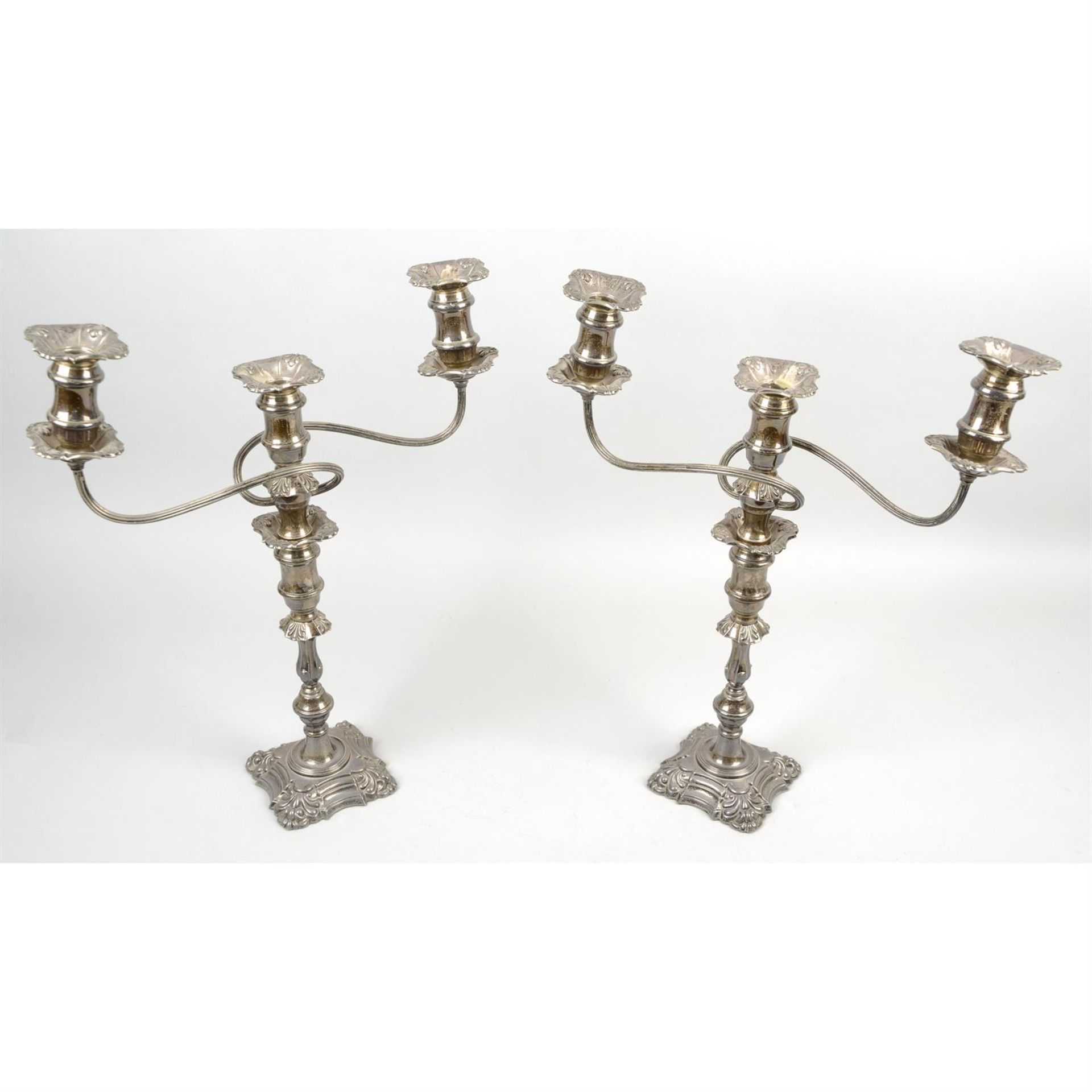 A pair of modern silver twin-branch candelabras (loaded).