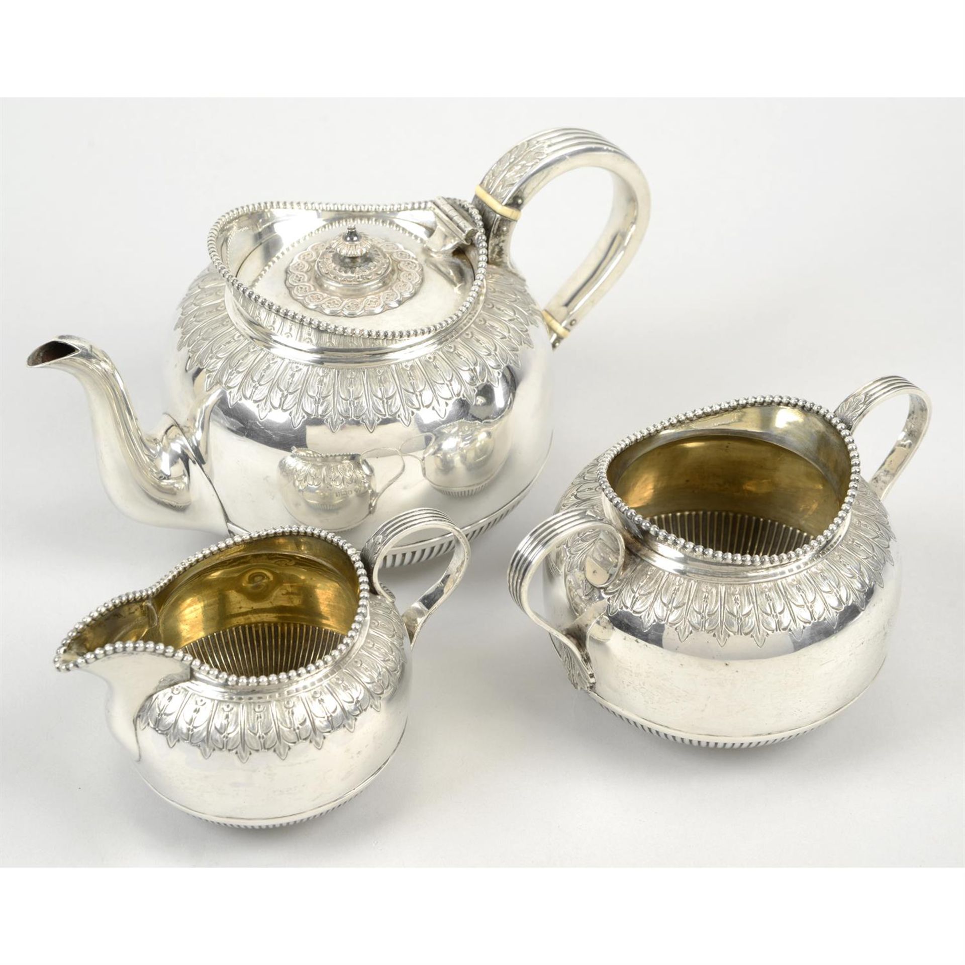 A late Victorian silver three piece tea set.