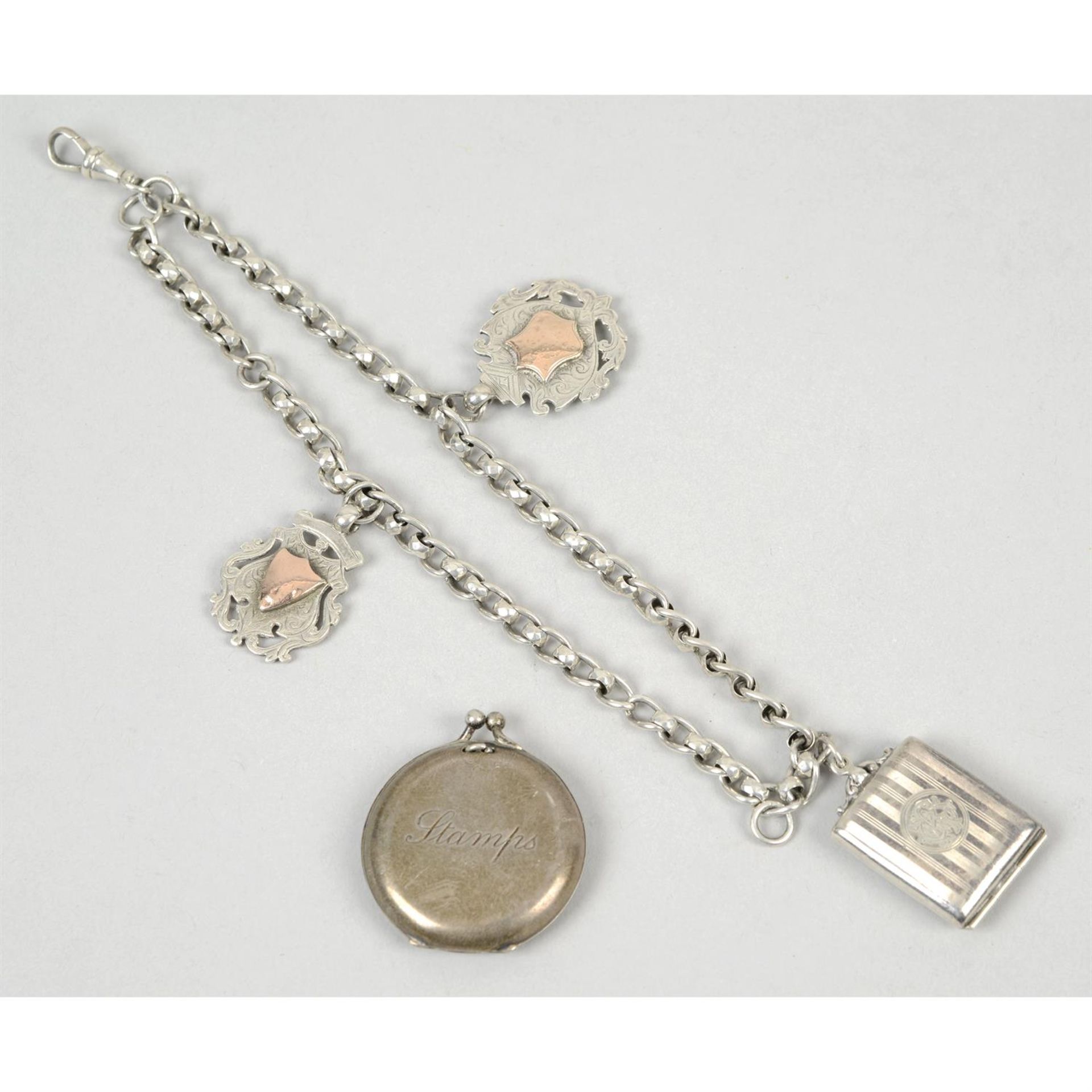 A watch chain with fob attachments; together with an Edwardian silver circular stamp case & a