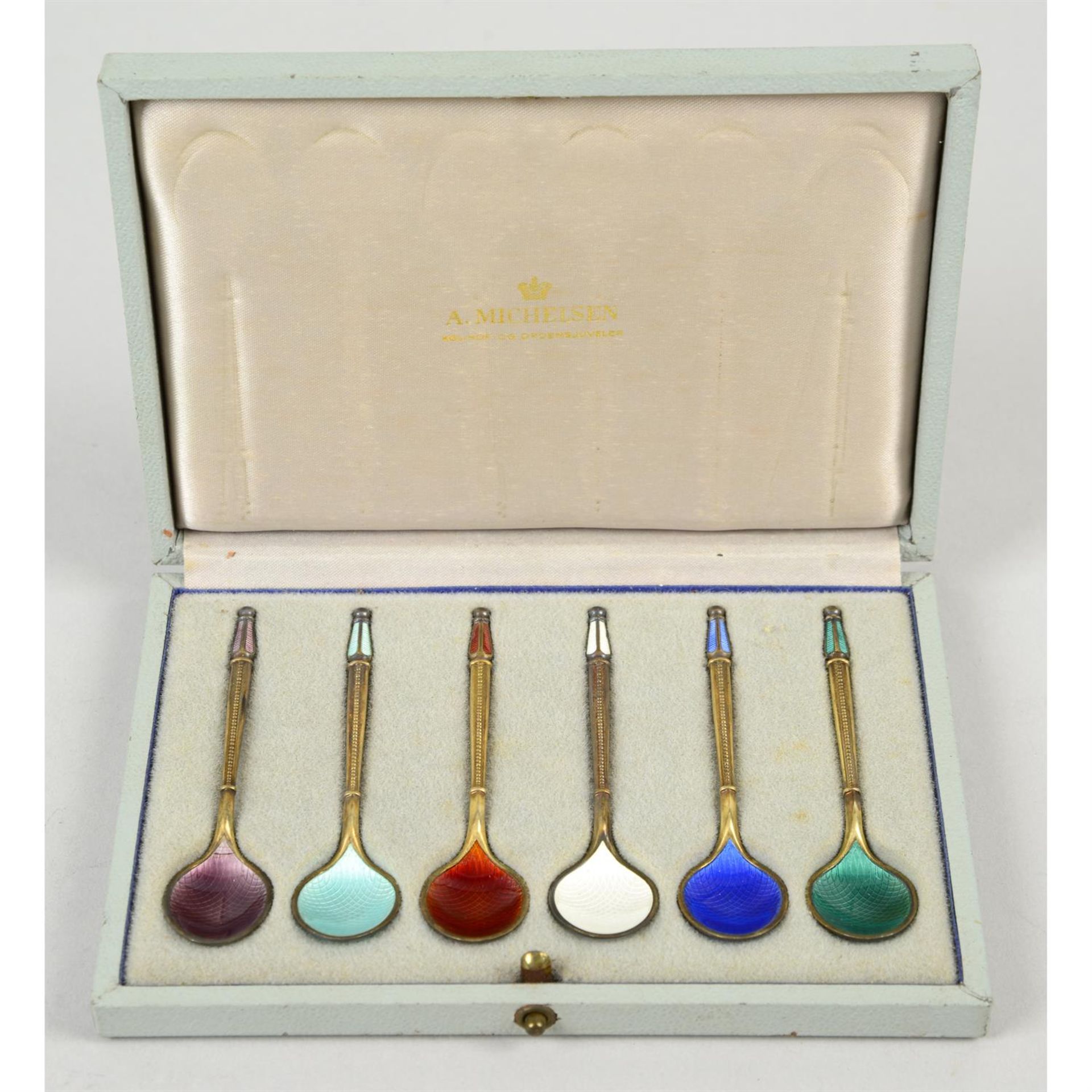 A cased set of six Danish silver-gilt & enamel coffee spoons, by A. Michelsen.