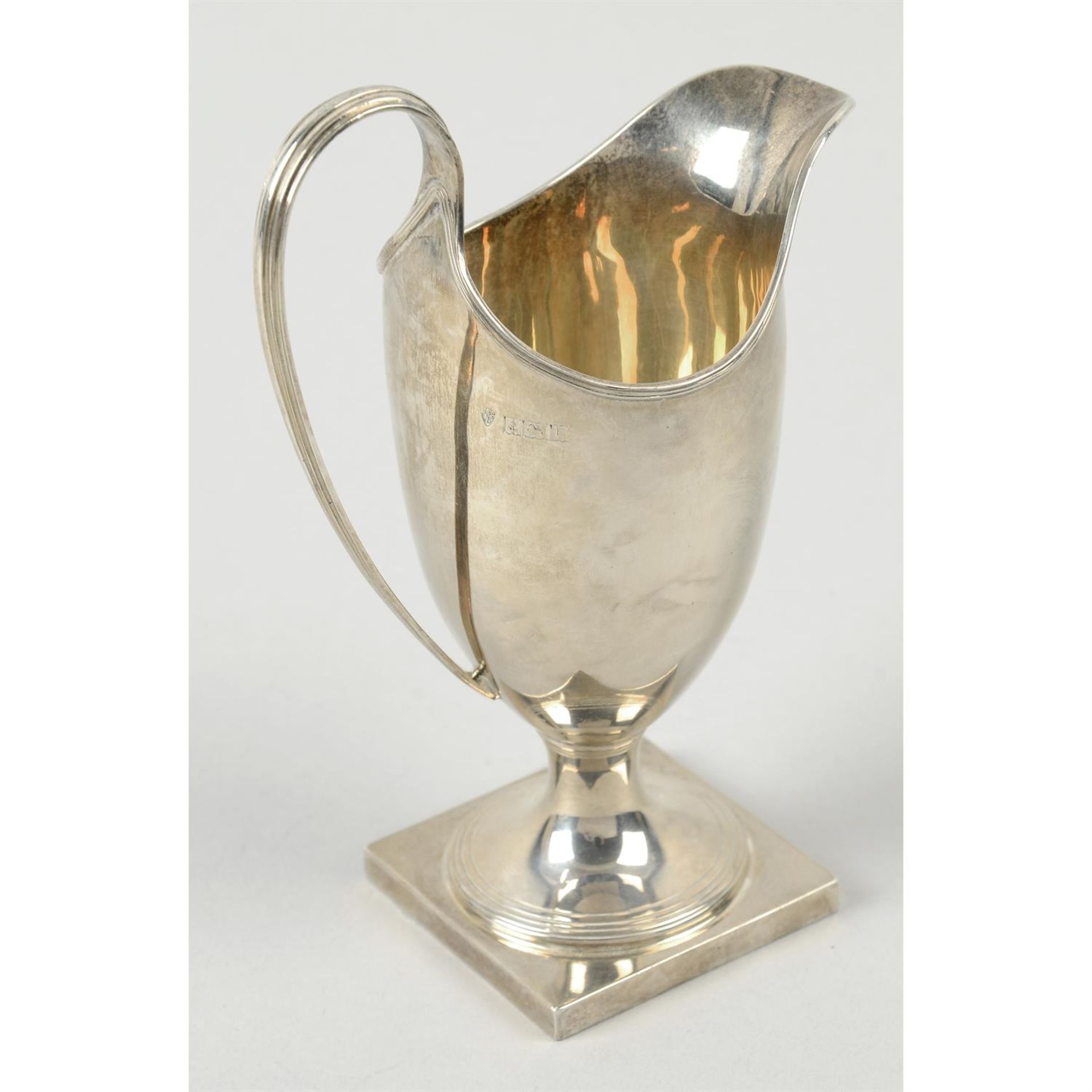 A modern silver helmet shape cream jug. - Image 2 of 3