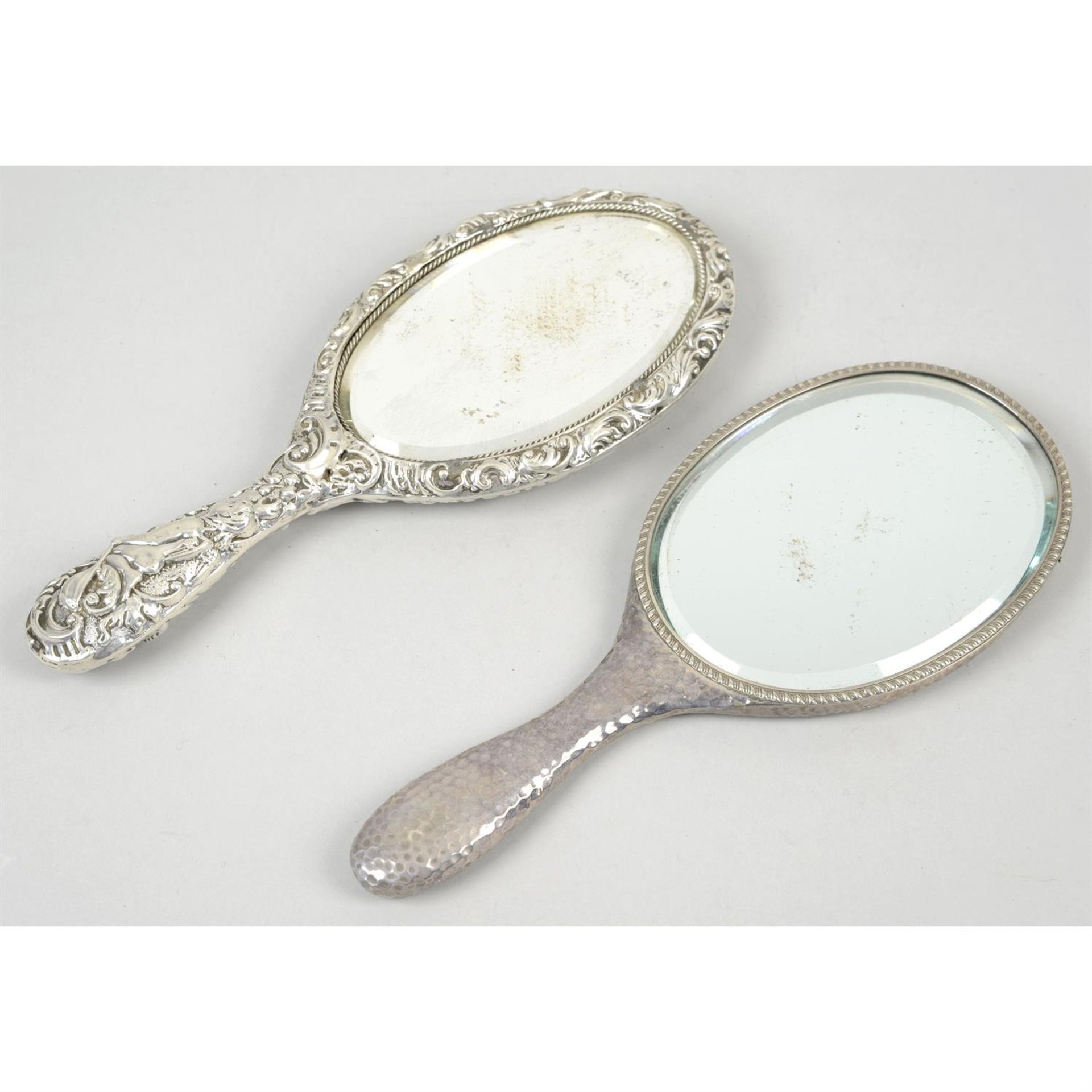 Two late Victorian silver mounted hand-held mirrors; together with a further mirror with plated - Image 2 of 5