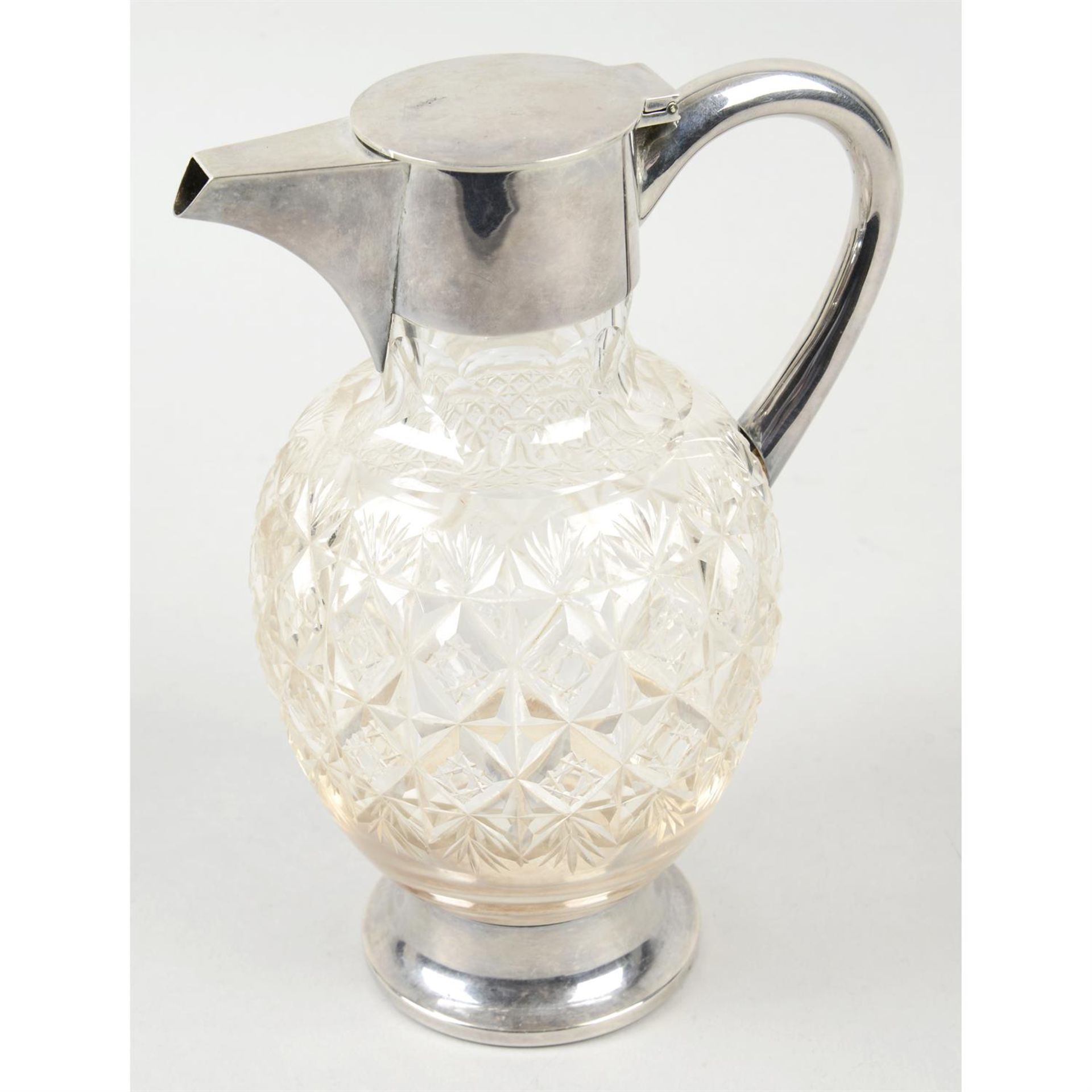 A late Victorian silver mounted & glass claret jug.