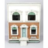 An early 20th century G and J Lines wooden dolls house.