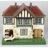 A small mid 20th century Triang number 61 wooden dolls house.