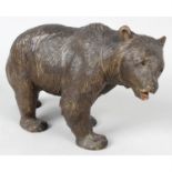 A carved Black Forest style study of a bear.