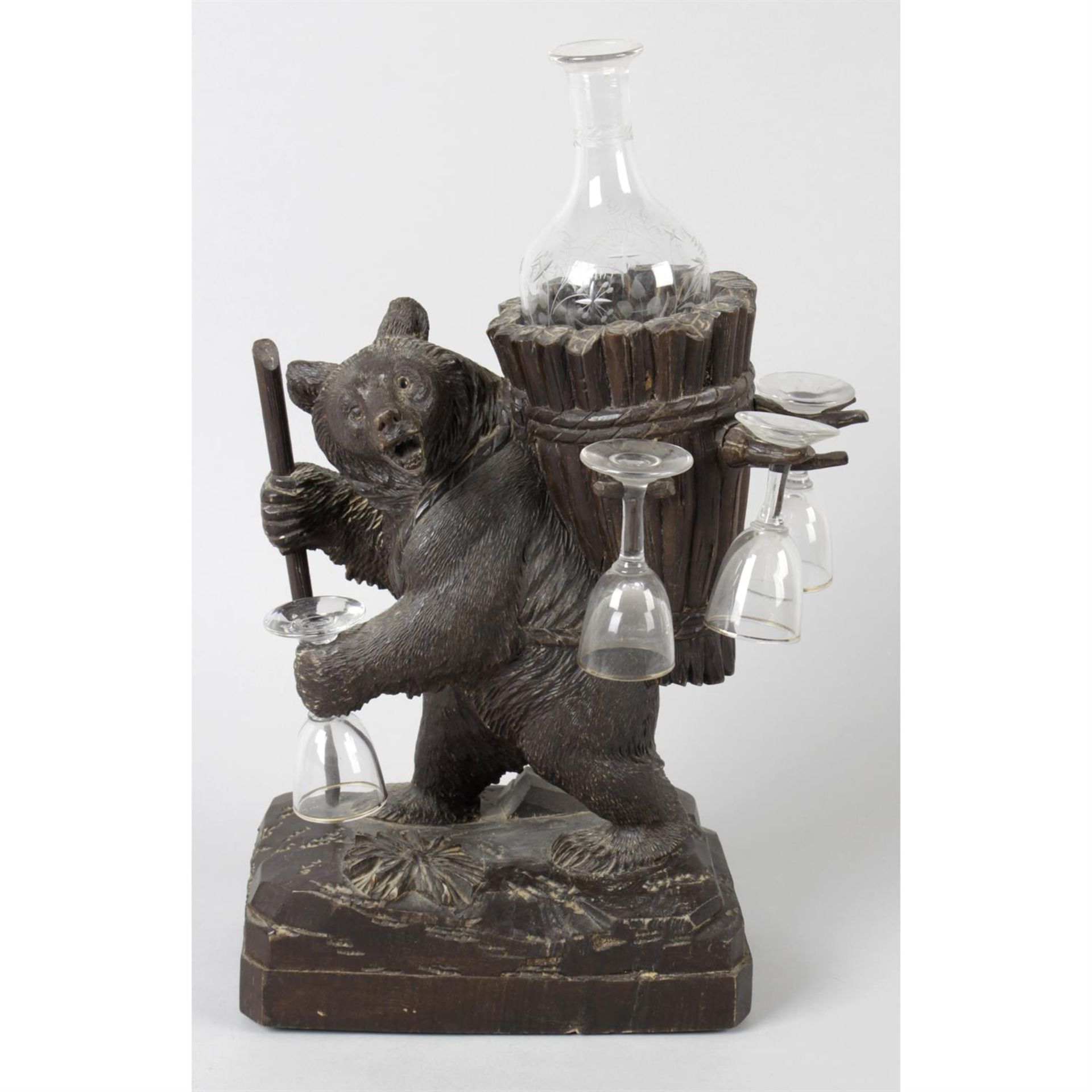 A 19th century carved Black Forest bear drinks dispenser.