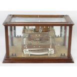 An unusual early 20th century glazed mahogany cased mirror backed ship builders 'half block' bridge