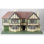 A 1930s Triang number 93 'Stockbroker-Tudor' wooden dolls house.