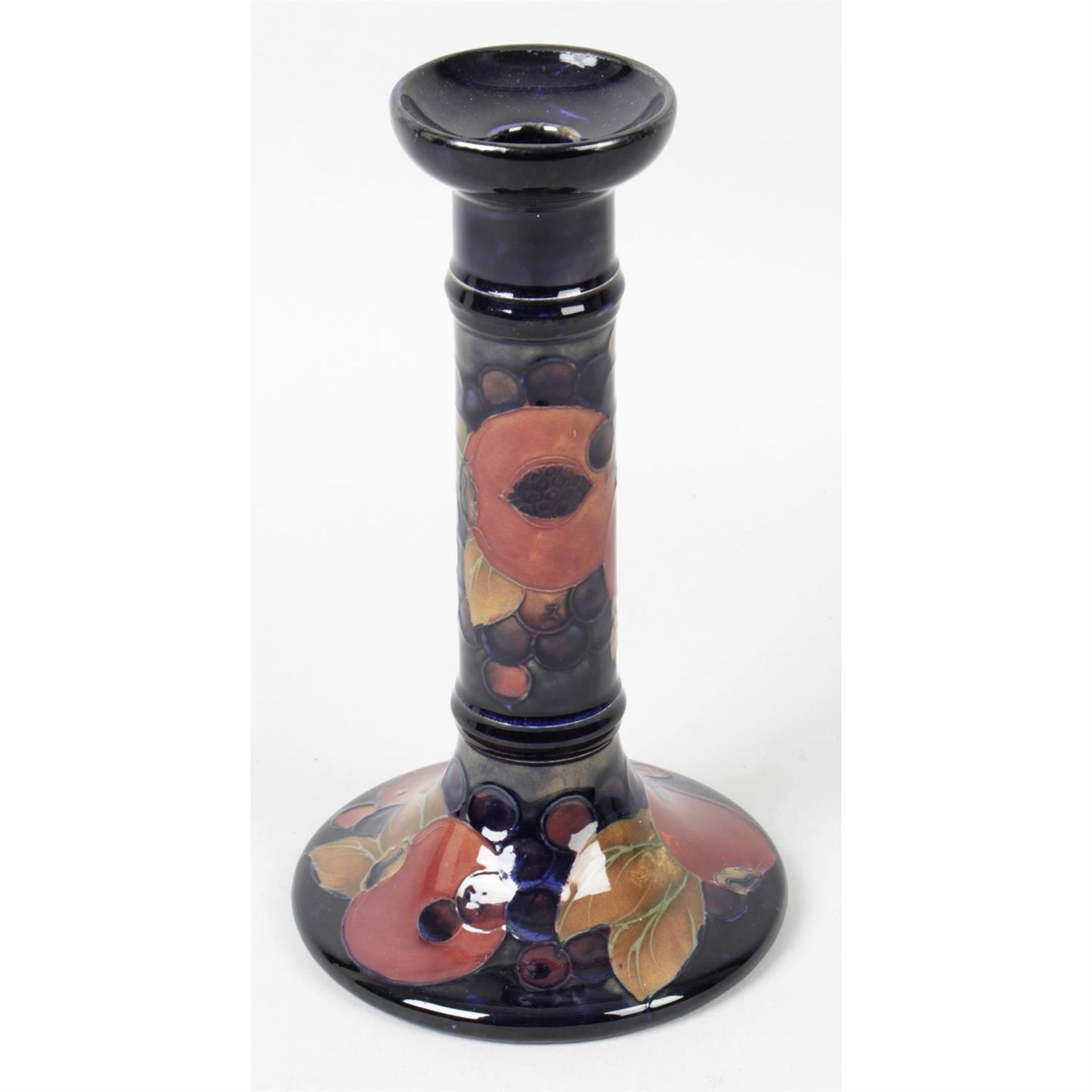 A single Moorcroft pottery candle stick.