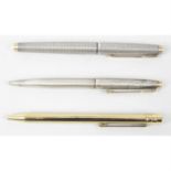 A Parker sterling silver cased pen, together with a Cartier pen and a Must de Cartier cigar cutter.