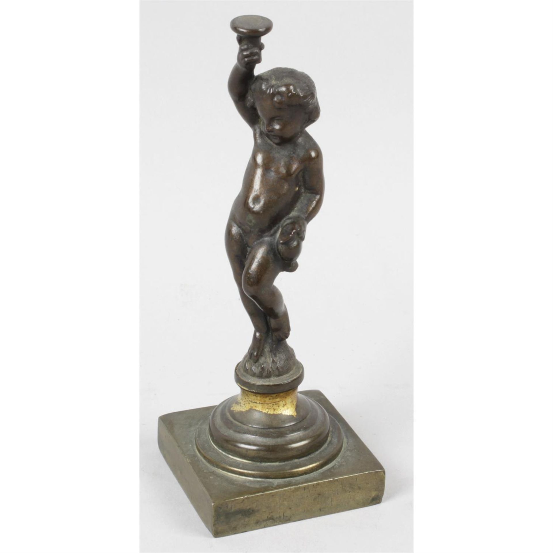 A 19th century bronze figure modelled as Putto.
