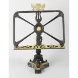 A bronze and gilt bronze table top sheet music or book stand.