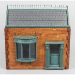 A small, painted wooden dolls house.