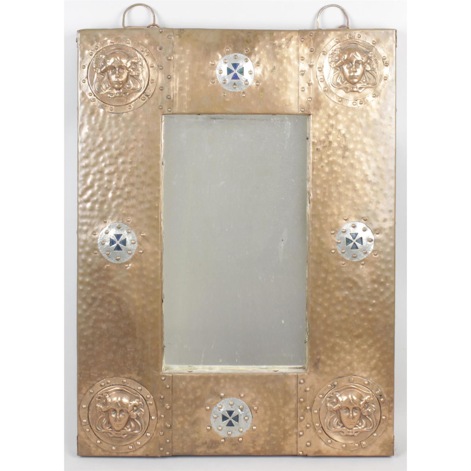 An Arts & Crafts copper framed wall mirror.