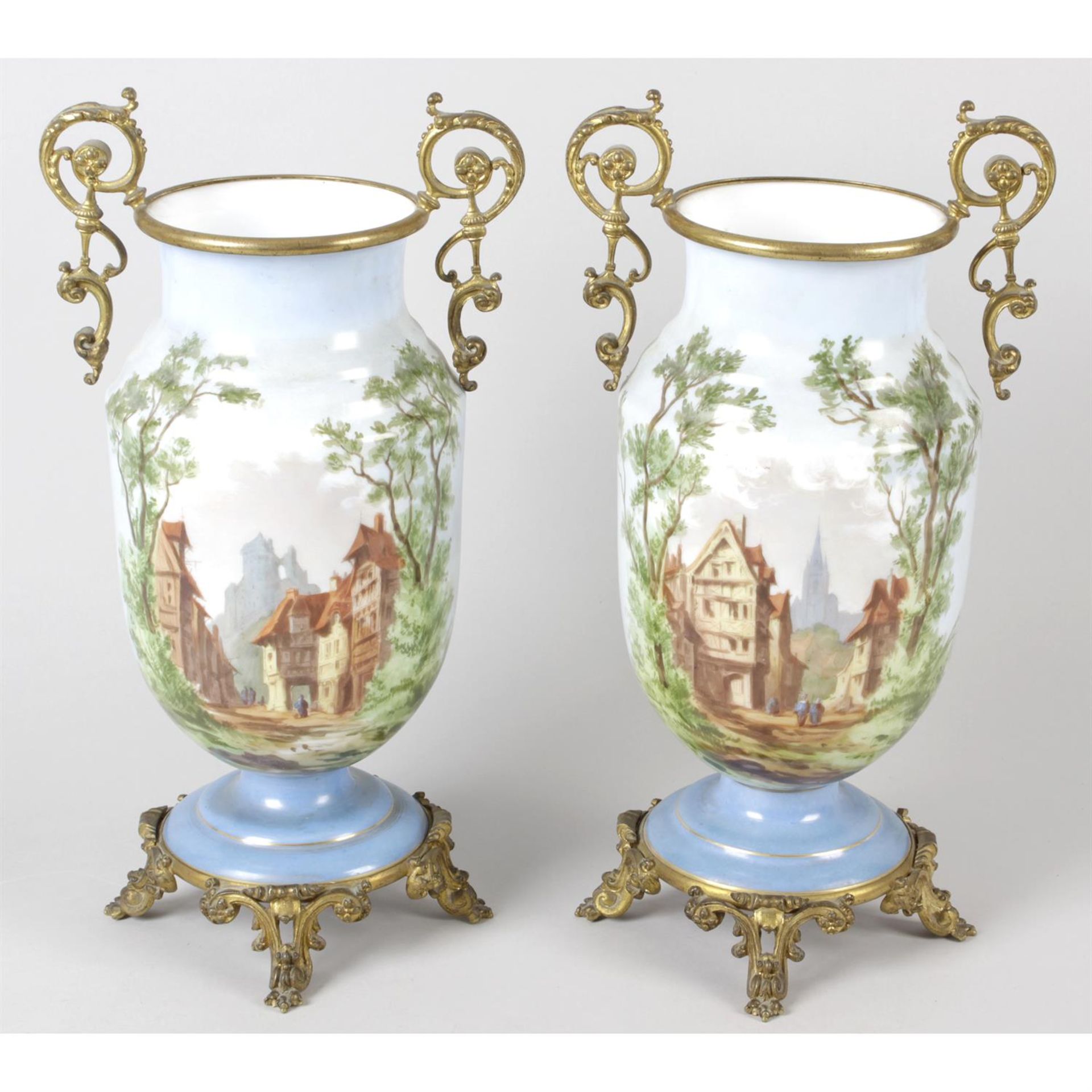 A pair of late 19th century gilt metal mounted opaque glass vases.